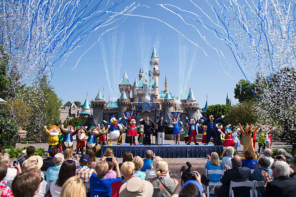 ANAHEIM, CA - JULY 17:  In this handout photo provided by Disney parks, Mickey Mouse and his friends celebrate the 60th anniversary of Disneyland park during a ceremony at Sleeping Beauty Castle featuring Academy Award-winning composer, Richard Sherman and Broadway actress and singer Ashley Brown July 17, 2015 in Anaheim, California.  Celebrating six decades of magic, the Disneyland Resort Diamond Celebration features three new nighttime spectaculars that immerse guests in the worlds of Disney stories like never before with 