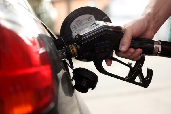 BERLIN - MARCH 23:  A gasoline station attendant pumps diesel into a car at a filling station on March 23, 2010 in Berlin, Germany. German President Horst Koehler said on Sunday higher petrol prices is the surest means to convince traditionally car-loving