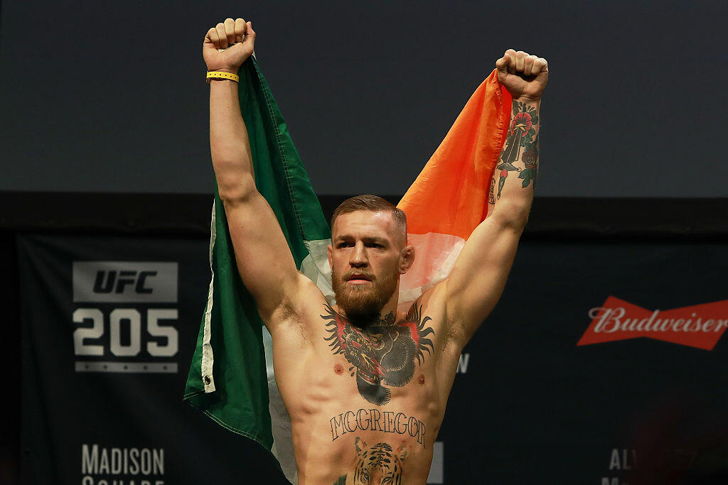 NEW YORK, NY - NOVEMBER 11:  UFC Featherweight Champion Conor McGregor reacts as he walks on stage for  UFC 205 Weigh-ins at Madison Square Garden on November 11, 2016 in New York City.  (Photo by Michael Reaves/Getty Images)