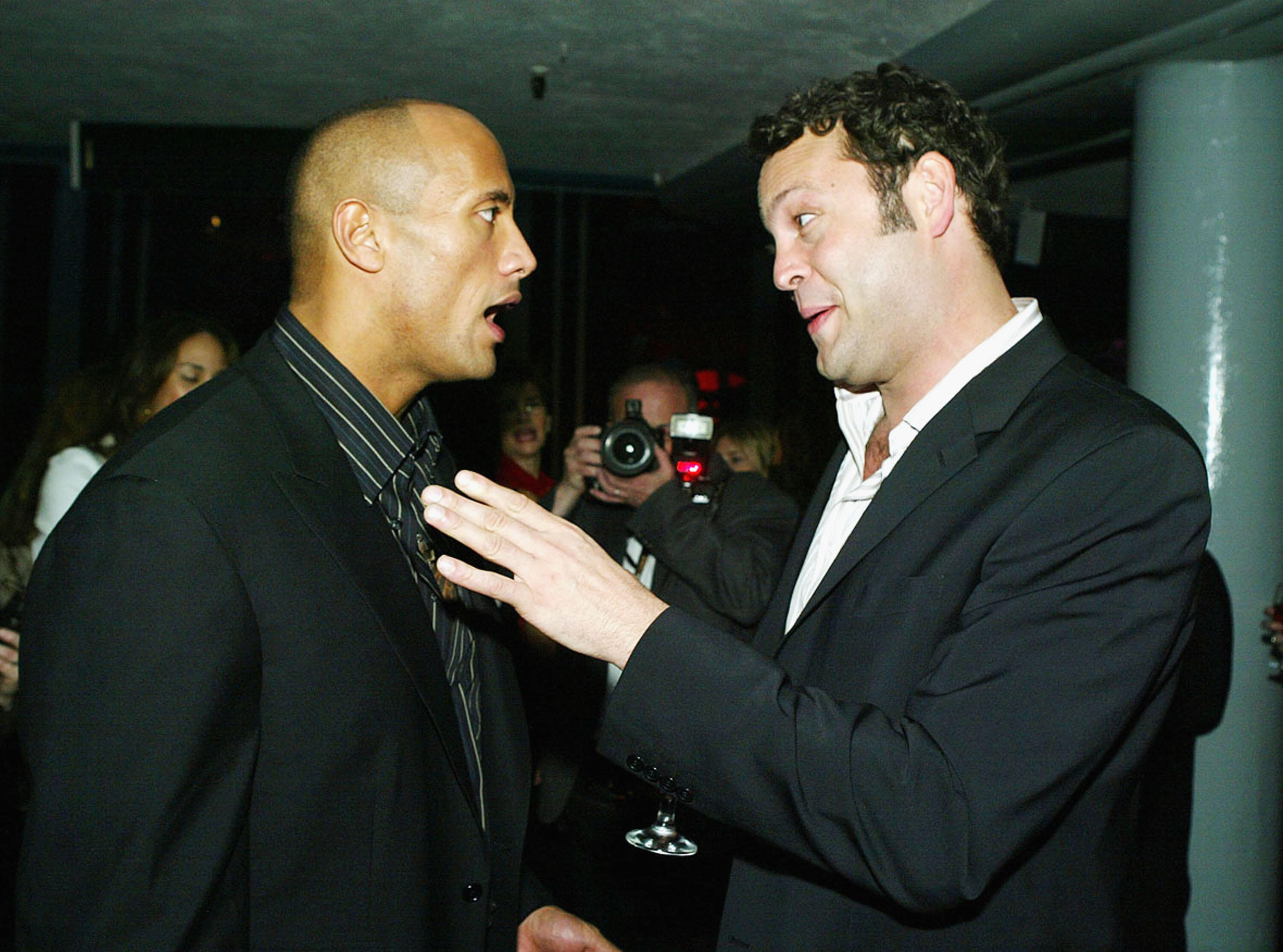 LOS ANGELES - FEBRUARY 14:  Actors Dwayne 'The Rock' Johnson(L) and Vince Vaughn talk at the after party for the Premiere of MGM's 