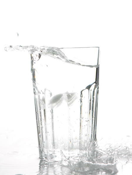BERLIN - JANUARY 14: Ice cubes drop into a glass of water on January 14, 2007 in Berlin, Germany.  (Photo Illustration by Andreas Rentz/Getty Images)