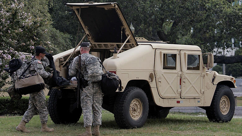 NEW ORLEANS - JUNE 20:  Members of the Louisiana National Guard remove supplies from their Humvee near City Hall June 20, 2006 in New Orleans, Louisiana. More than 100 National Guard troops have been deployed to help patrol areas ravaged by Hurricane Katr