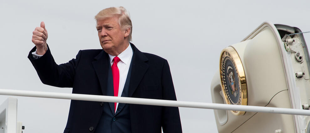 US President Donald Trump boards Air Force One at Andrews Air Force Base in Maryland on February 17, 2017 as he departs to attend the unveiling of the Boeing 787-10 Dreamliner in North Charleston, South Carolina. / AFP / NICHOLAS KAMM        (Photo credit