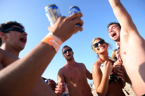 SOUTH PADRE ISLAND, TX - MARCH 25:  Students drink on the beach during the annual ritual of Spring Break March 25, 2008 on South Padre Island, Texas.  The South Texas island is one of the top Spring Break destinations and attracts students from all over t