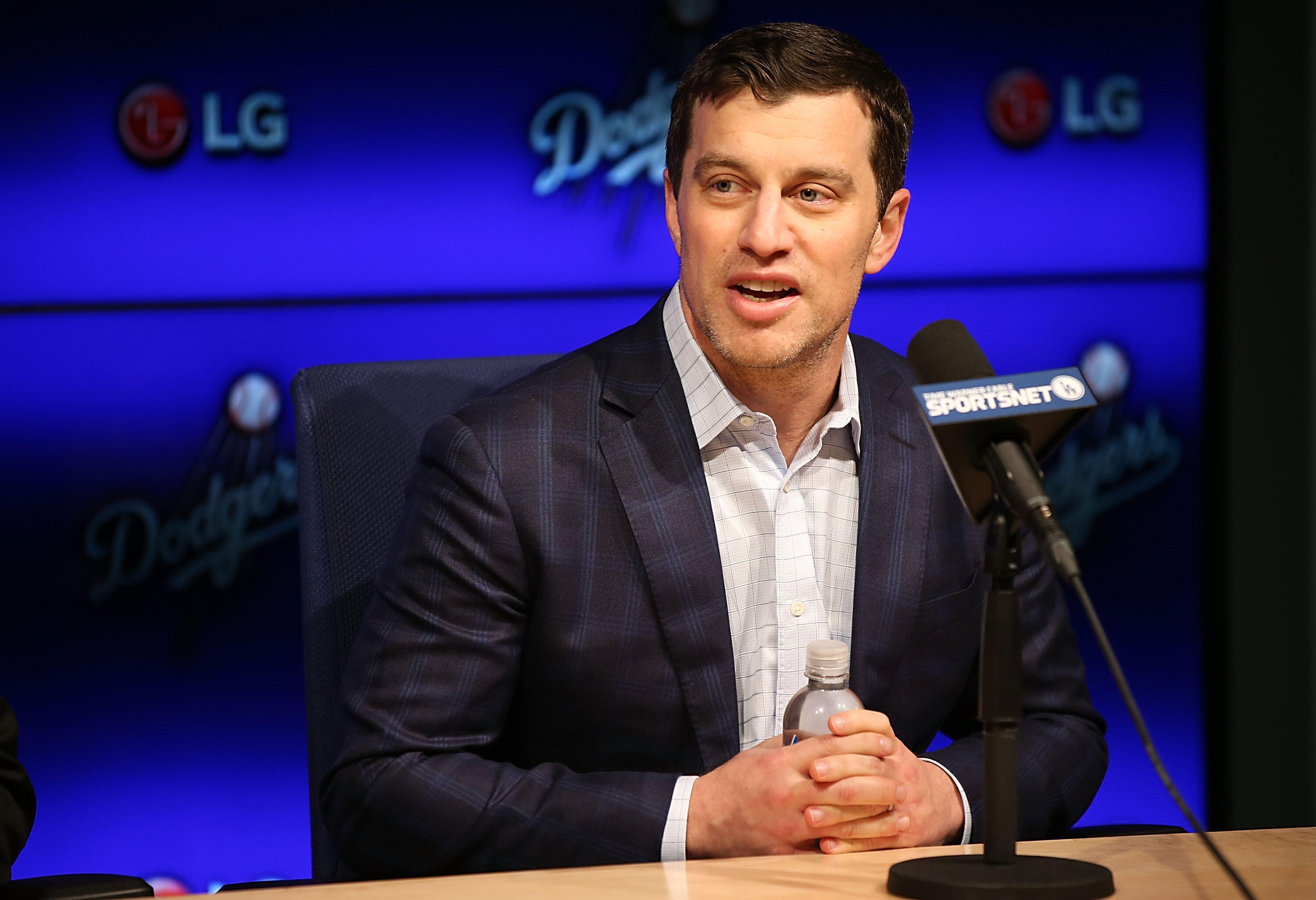 LOS ANGELES, CA - JANUARY 07:  Dodgers president of baseball operations Andrew Friedman introduces Pitcher Kenta Maeda to the Los Angeles Dodgers at Dodger Stadium on January 7, 2016 in Los Angeles, California.  (Photo by Joe Scarnici/Getty Images)