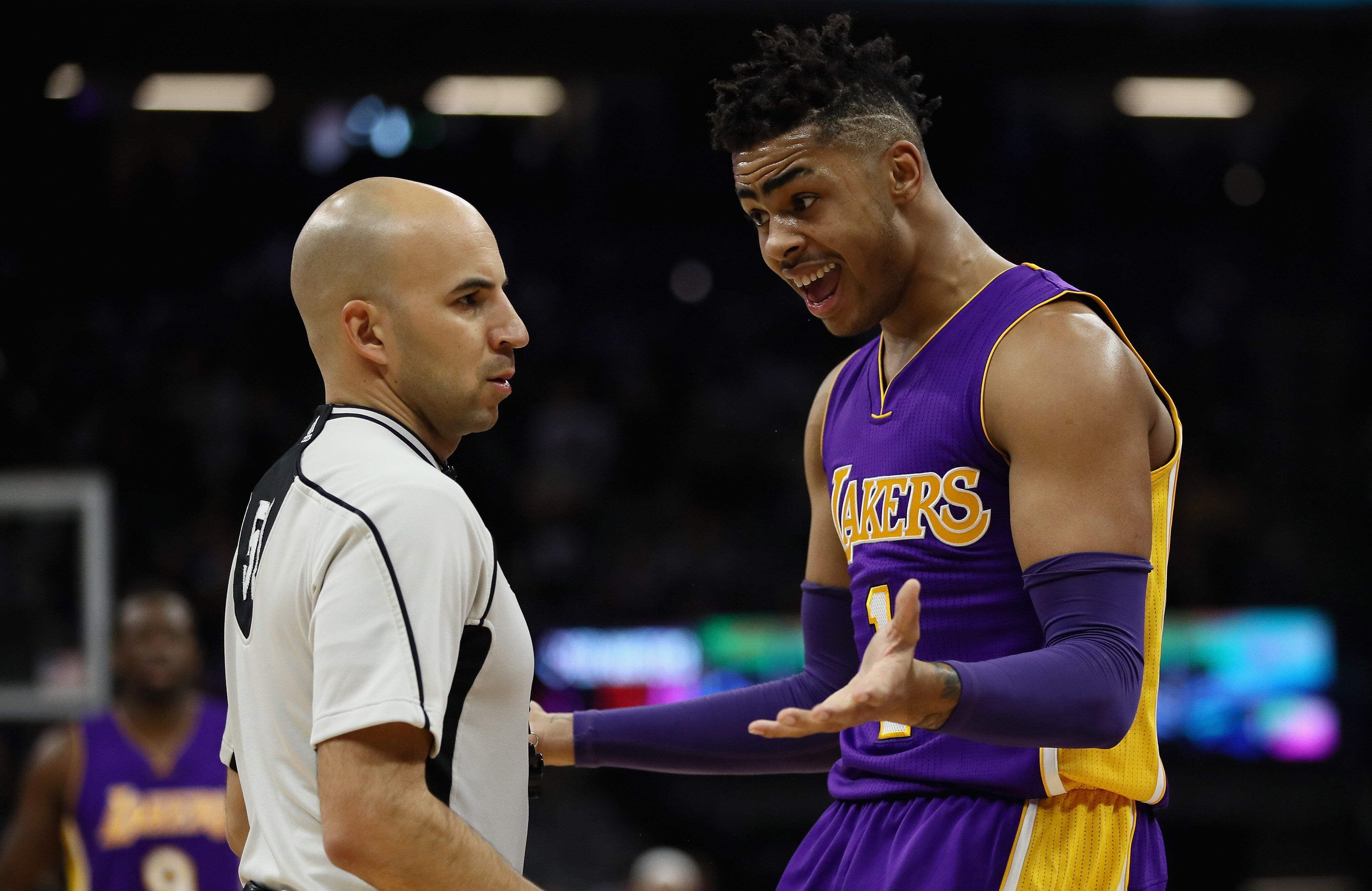 SACRAMENTO, CA - DECEMBER 12:  D'Angelo Russell #1 of the Los Angeles Lakers questions a call by referee Aaron Smith during their game against the Sacramento Kings at Golden 1 Center on December 12, 2016 in Sacramento, California.  NOTE TO USER: User expr