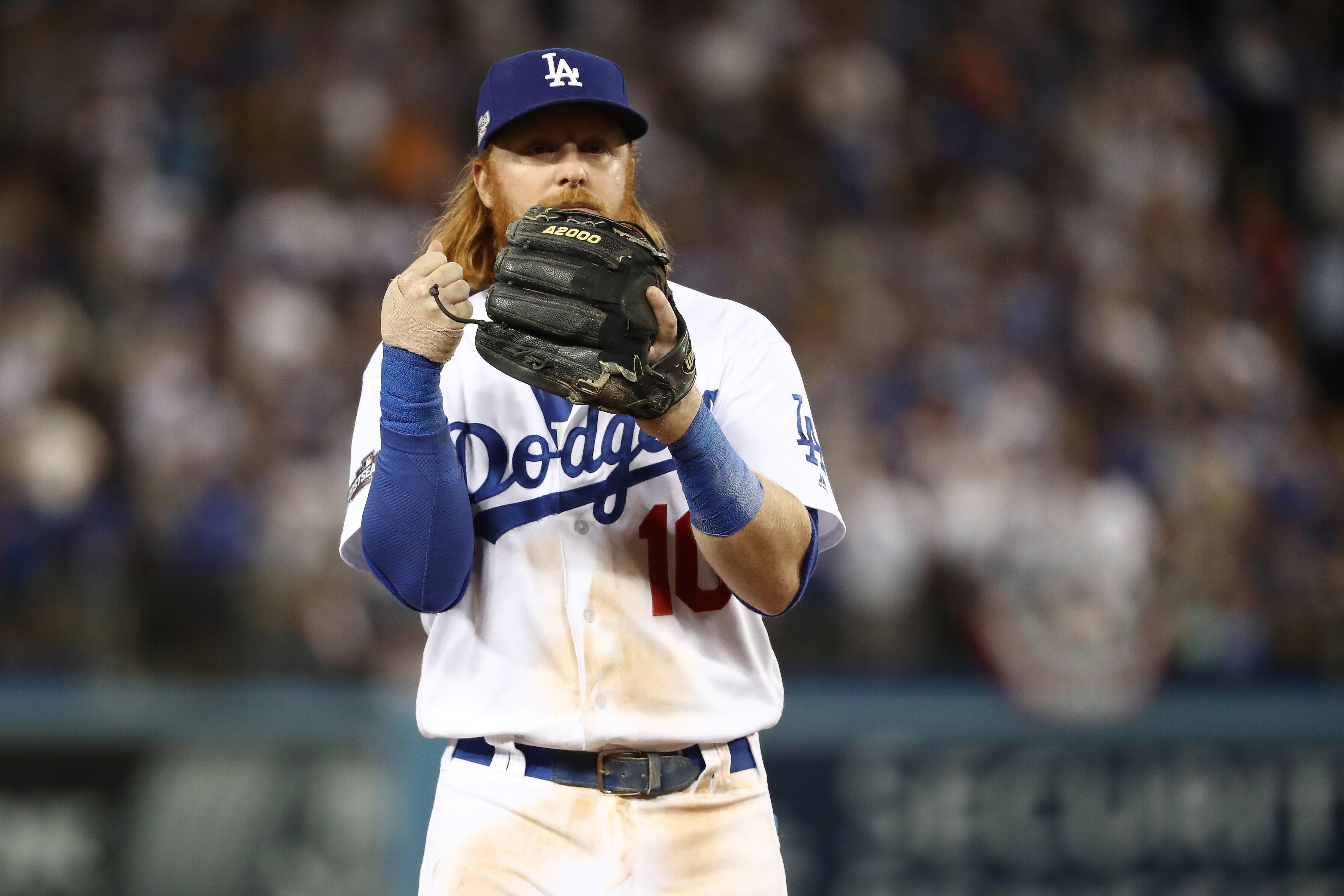 LOS ANGELES, CA - OCTOBER 20: Justin Turner #10 of the Los Angeles Dodgers reacts at third base against the Chicago Cubs in game five of the National League Division Series at Dodger Stadium on October 20, 2016 in Los Angeles, California.  (Photo by Sean 