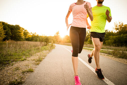 Friends jogging at sunset