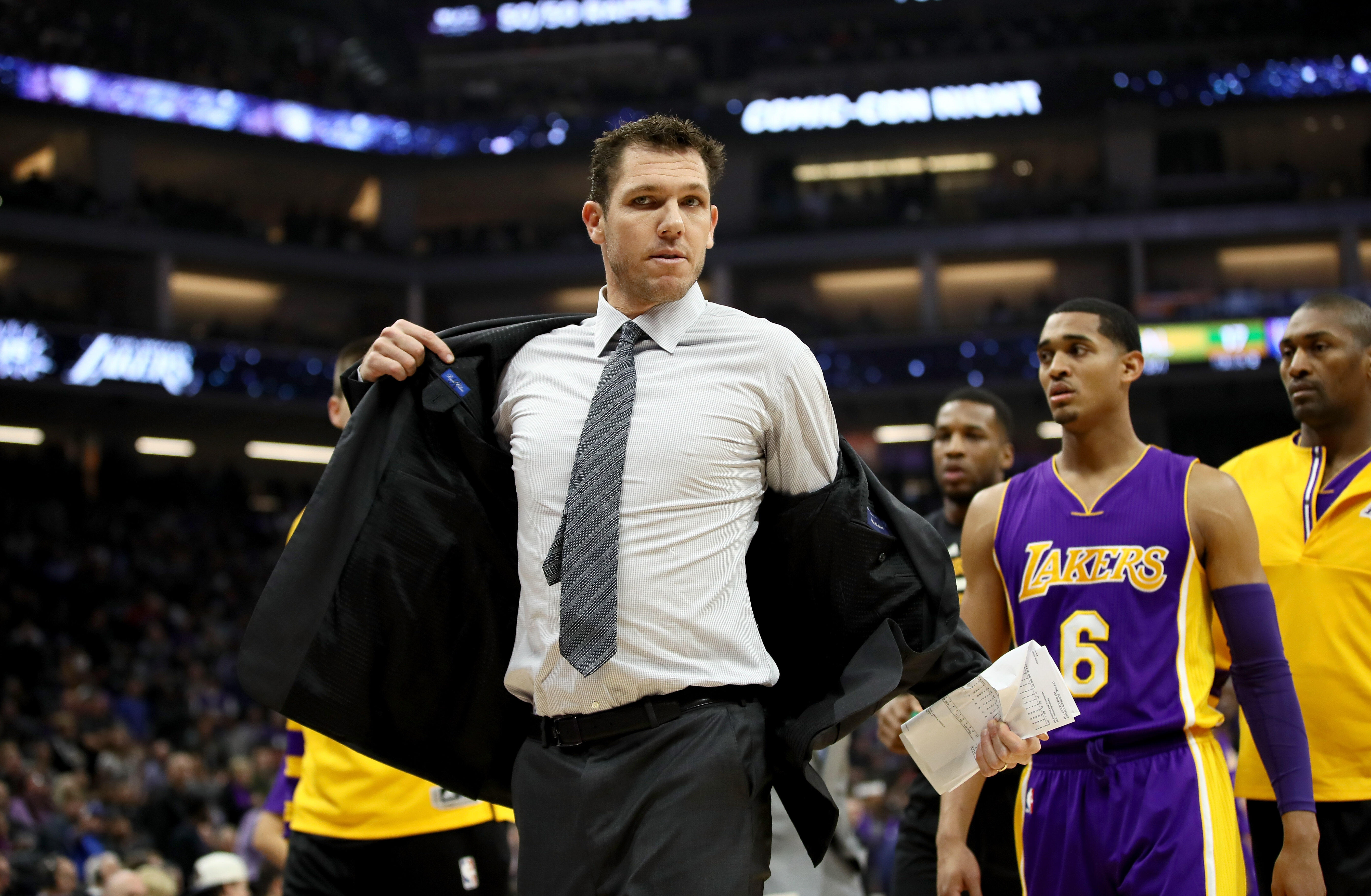 SACRAMENTO, CA - DECEMBER 12:  Head coach Luke Walton of the Los Angeles Lakers takes off his jacket after he was ejected from the game for a double technical fould after he complaned about a call during their game against the Sacramento Kings at Golden 1