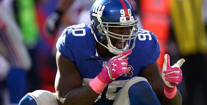 EAST RUTHERFORD, NJ - OCTOBER 05:  Defensive end Jason Pierre-Paul #90 of the New York Giants reacts after a play in the fourth quarter against the Atlanta Falcons during their game at MetLife Stadium on October 5, 2014 in East Rutherford, New Jersey.  (P