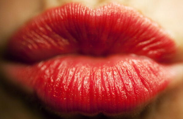 Picture taken on February 10, 2011 shows lips covered with red lipstick forming a kiss. On July 6, 2011 is international kissing day.     AFP PHOTO / ROLF VENNENBERND    GERMANY OUT (Photo credit should read ROLF VENNENBERND/AFP/Getty Images)