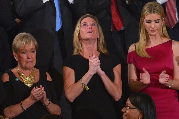 Carryn Owens, the wife of slain Navy SEAL William Ryan Owens, looks up while being acknowledged by US President Donald Trump during his address to a joint session of Congress at the US Capitol in Washington, DC on February 28, 2017. / AFP / MANDEL NGAN        (Photo credit should read MANDEL NGAN/AFP/Getty Images)