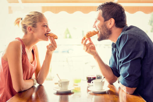 Young couple have breakfast at italian cafÃ©