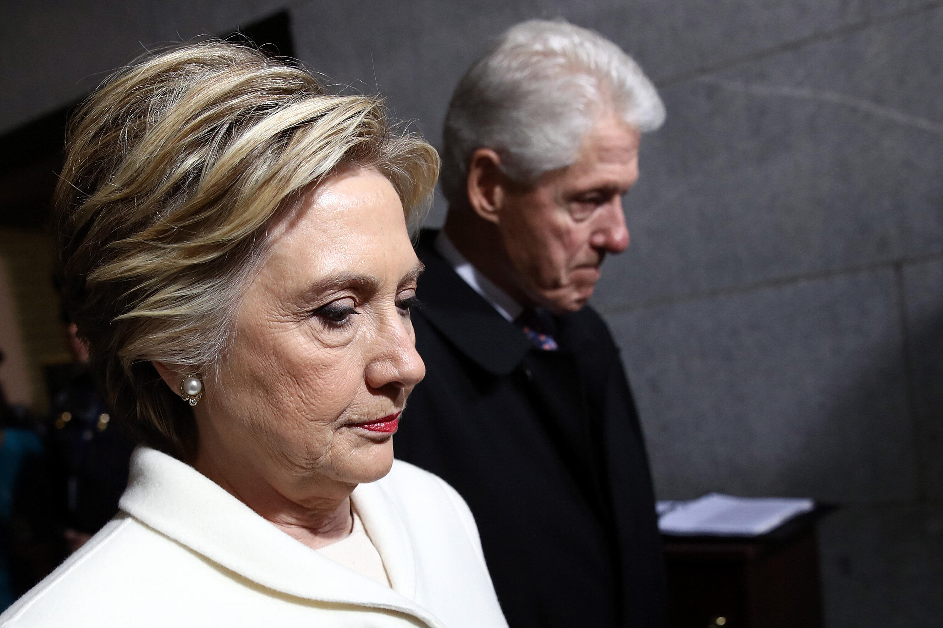 Former Democratic presidential nominee Hillary Clinton and former US President Bill Clinton arrive on the West Front of the US Capitol on January 20, 2017 in Washington, DC. Donald Trump took the first ceremonial steps before being sworn in as the 45th pr