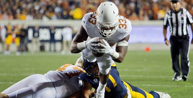 BERKELEY, CA - SEPTEMBER 17:  Running back D'Onta Foreman #33 of the Texas Longhorns dives for the end zone to score a touchdown against safety Luke Rubenzer #17 of the California Golden Bears in the second quarter on September 17, 2016 at California Memo