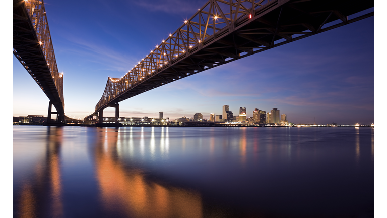 USA, Louisiana, New Orleans, Toll bridge over Mississippi River at sunset