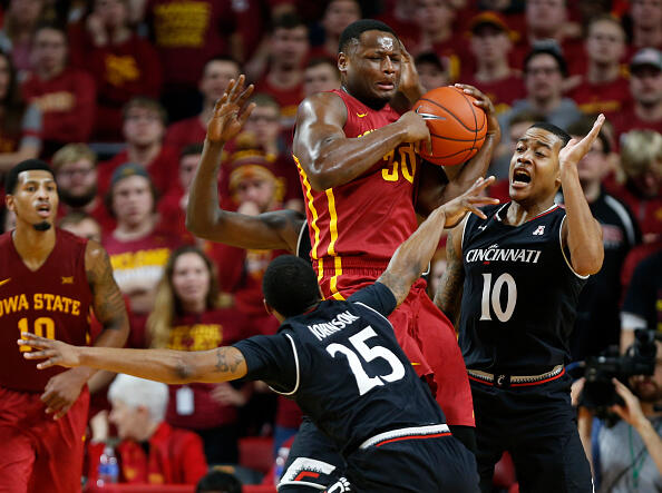 AMES, IA - DECEMBER 1:  Deonte Burton #30 of the Iowa State Cyclones battles for a rebound with Kevin Johnson #25, and Troy Caupain #10 of the Cincinnati Bearcats in the second half of play at Hilton Coliseum on December 1, 2016 in Ames, Iowa. The Cincinnati Bearcats won 55-54 over the Iowa State Cyclones. (Photo by David Purdy/Getty Images)