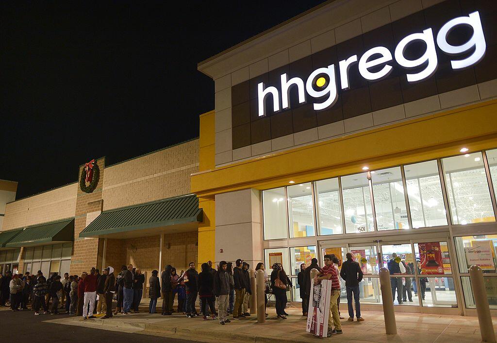 Shoppers queue outside of a hh Gregg electronics which began their Black Friday sales before midnight November 22, 2012 in Rockville, Maryland  Thanksgiving, the last US holiday undisturbed by mass commercialization, is now victim to the ever advancing Ch