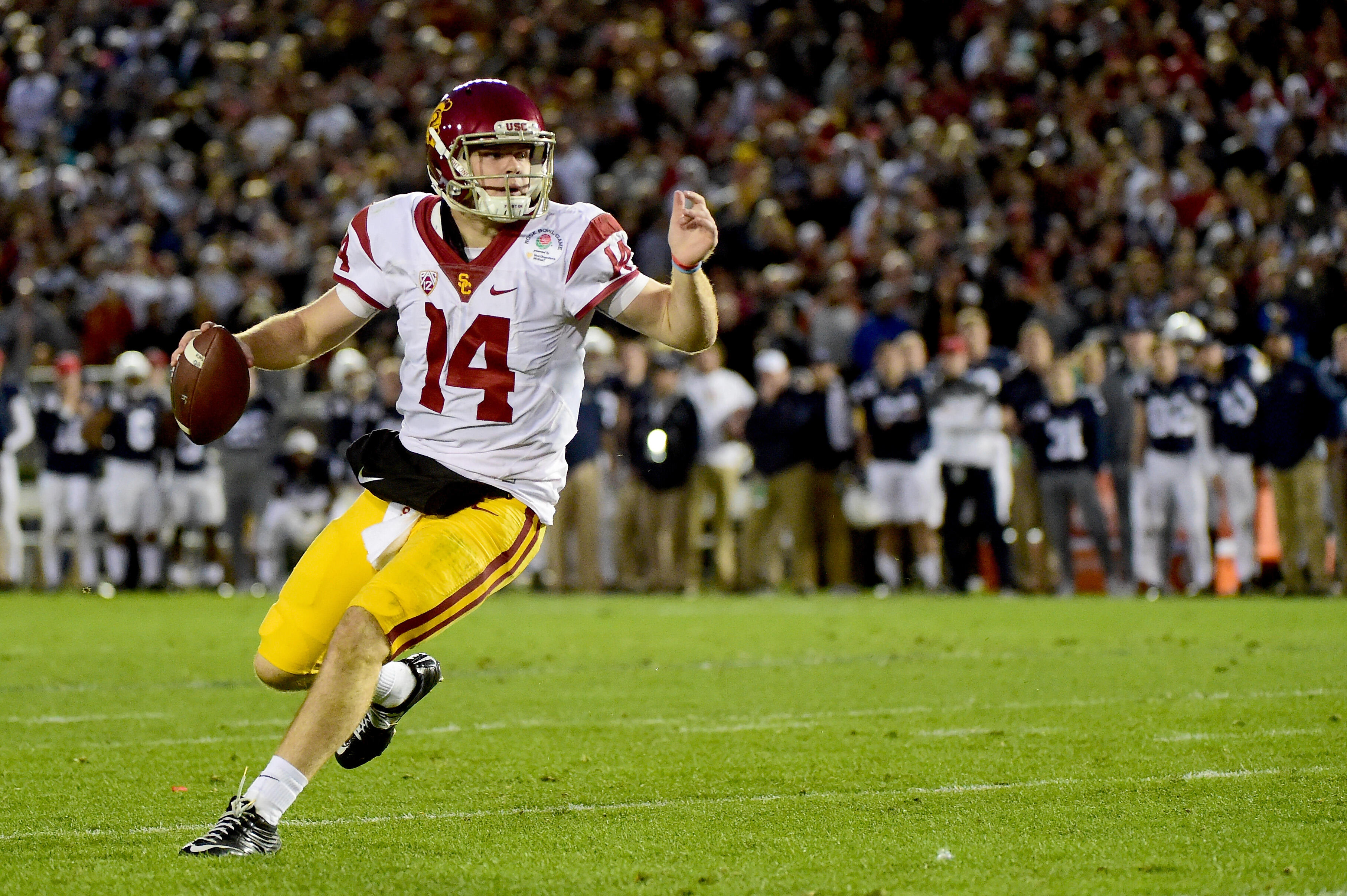 PASADENA, CA - JANUARY 02:  Quarterback Sam Darnold #14 of the USC Trojans scrambles prior to throwing a touchdown pass in the third quarter against the Penn State Nittany Lions during the 2017 Rose Bowl Game presented by Northwestern Mutual at the Rose B