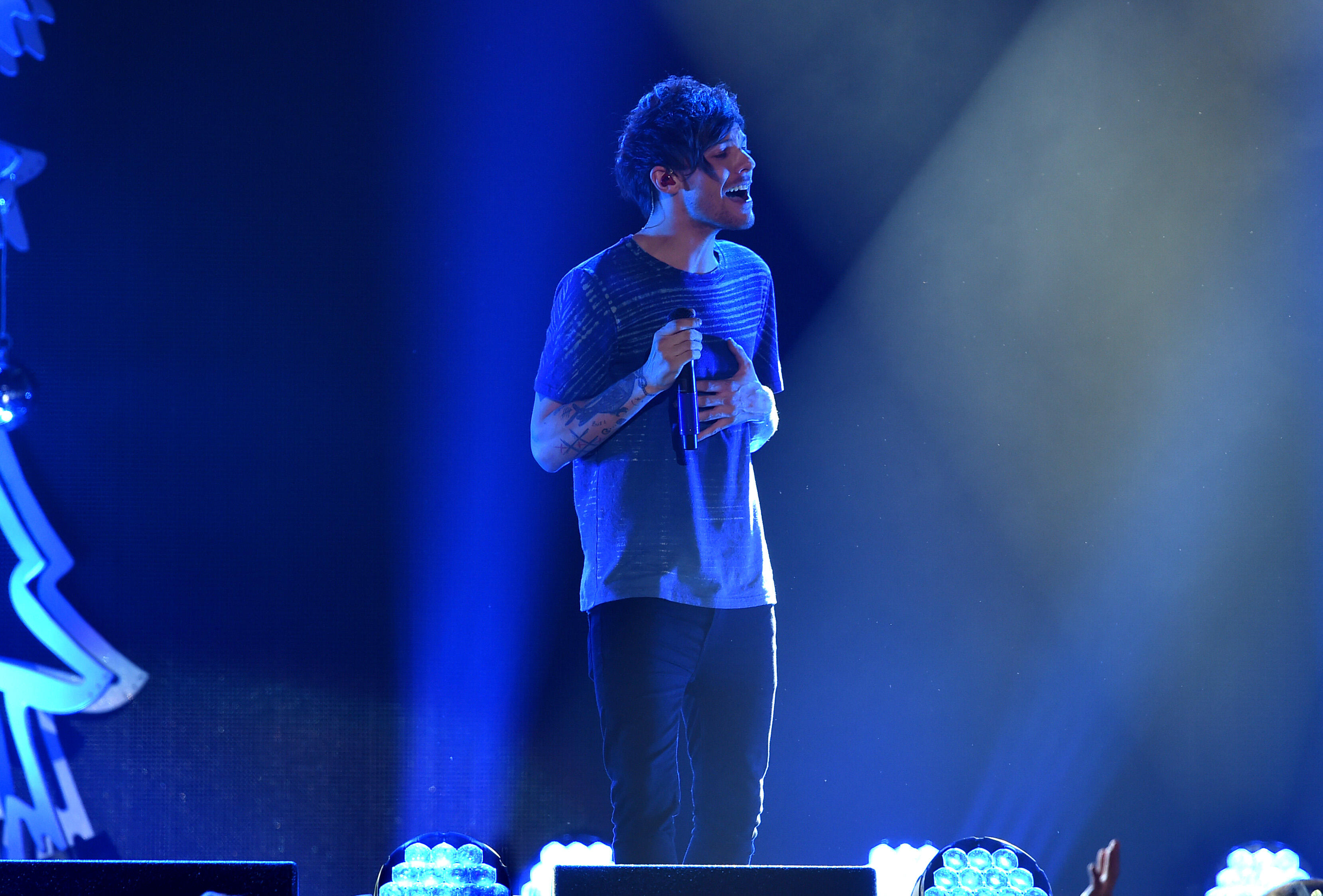 LOS ANGELES, CA - DECEMBER 04:  Recording artist Louis Tomlinson of One Direction performs onstage during 102.7 KIIS FMs Jingle Ball 2015 Presented by Capital One at STAPLES CENTER on December 4, 2015 in Los Angeles, California.  (Photo by Kevin Winter/