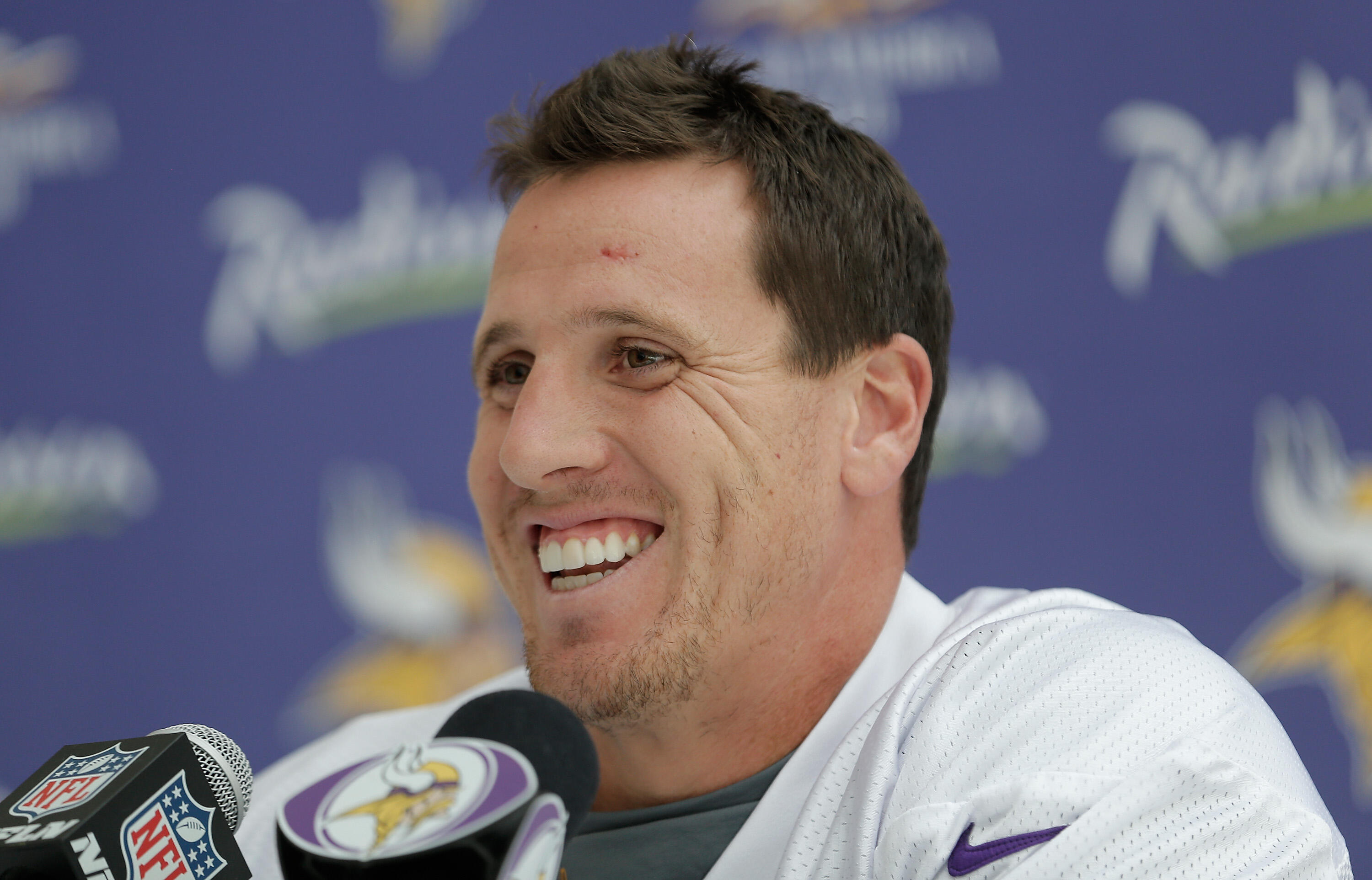 LONDON, ENGLAND - SEPTEMBER 26:  Linebacker Chad Greenway talks to members of the press during a Minnesota Vikings press conference at the Grove Hotel on September 26, 2013 in London, England.  (Photo by Harry Engels/Getty Images)