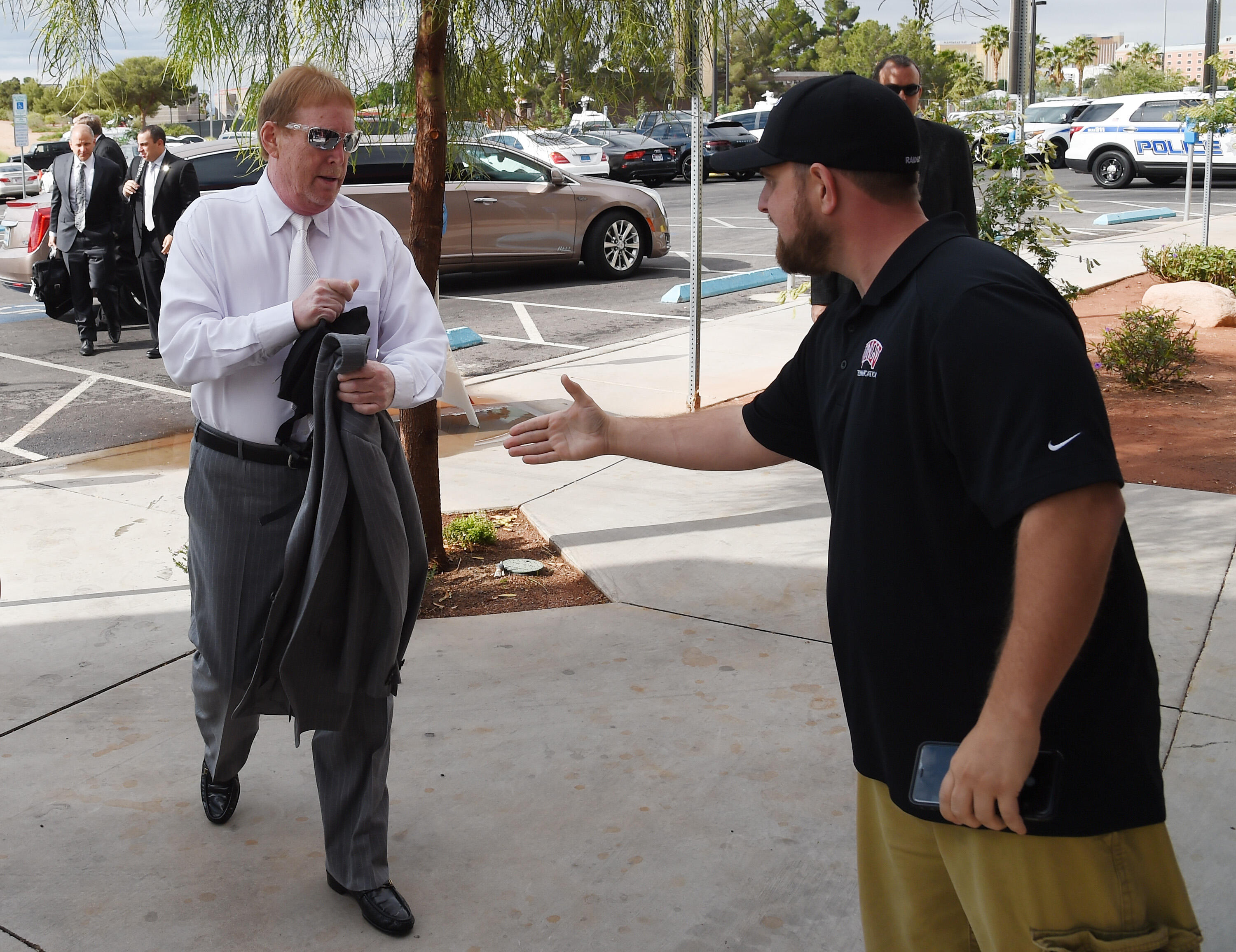 LAS VEGAS, NV - APRIL 28:  Oakland Raiders owner Mark Davis (L) is greeted as he arrives at a Southern Nevada Tourism Infrastructure Committee meeting at UNLV on April 28, 2016 in Las Vegas, Nevada. Davis told the committee he is willing to spend USD 500 