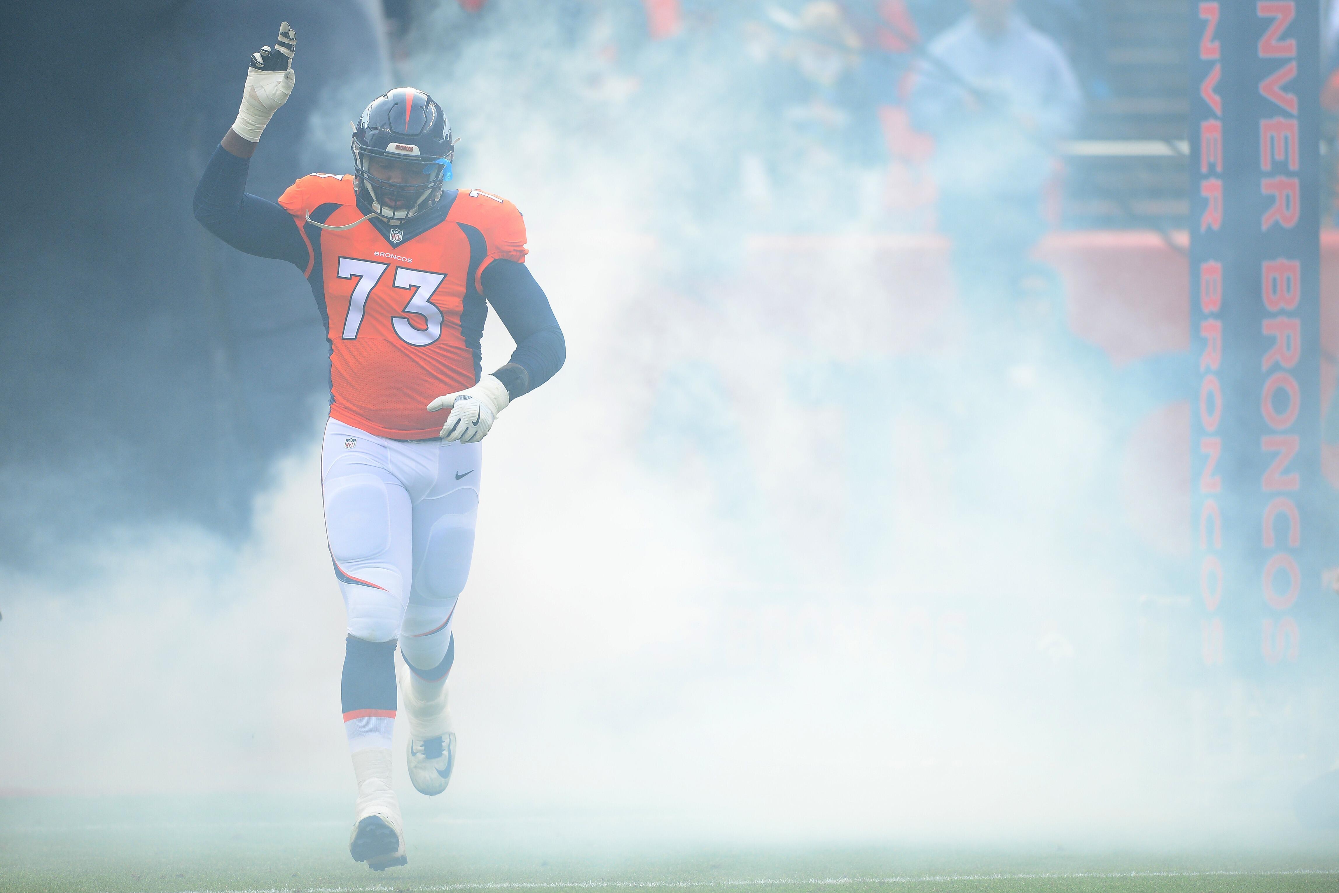 DENVER, CO - JANUARY 1:  Offensive tackle Russell Okung #73 of the Denver Broncos is introduced to the game against the Oakland Raiders at Sports Authority Field at Mile High on January 1, 2017 in Denver, Colorado. (Photo by Dustin Bradford/Getty Images)