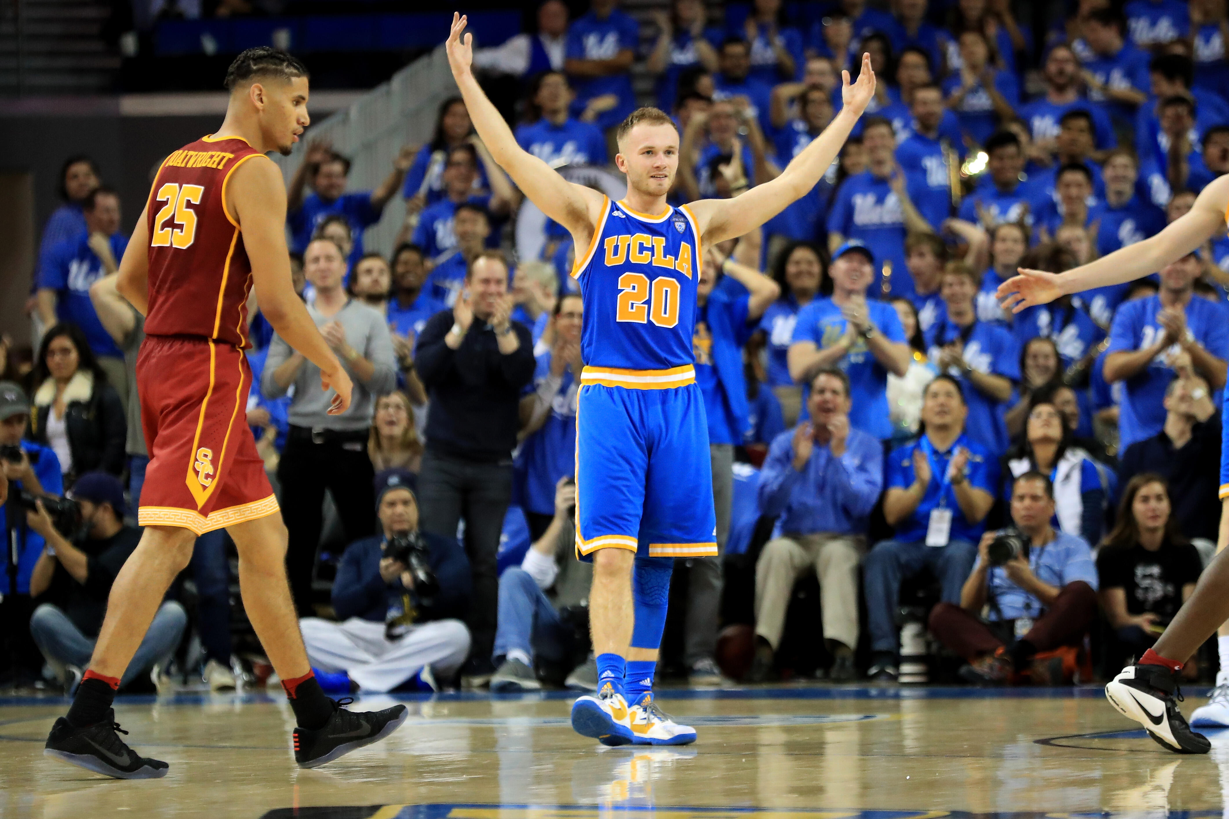 LOS ANGELES, CA - FEBRUARY 18:  Bryce Alford #20 of the UCLA Bruins reacts to a shot as Bennie Boatwright #25 of the USC Trojans loks on during the second half of a game at Pauley Pavilion on February 18, 2017 in Los Angeles, California.  (Photo by Sean M