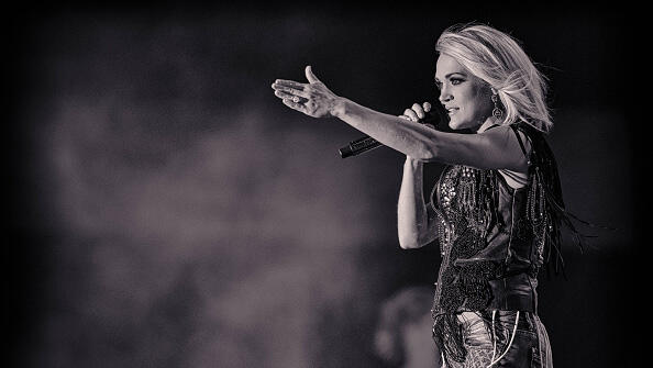INDIO, CA - APRIL 30:  (EDITORS NOTE: Image has been converted to black and white.)  Singer Carrie Underwood performs onstage during 2016 Stagecoach California's Country Music Festival at Empire Polo Club on April 30, 2016 in Indio, California.  (Photo by