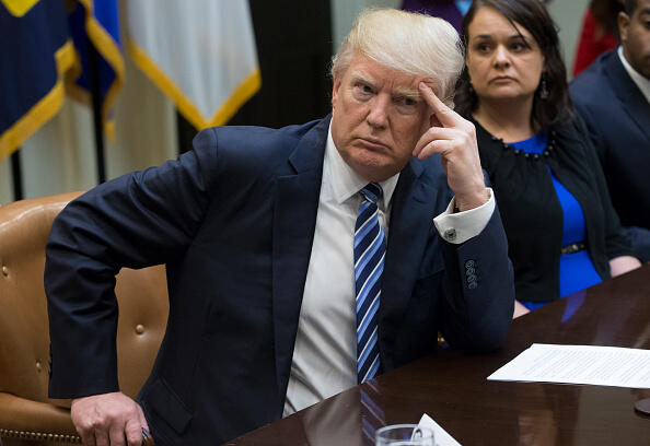 WASHINGTON, DC - MARCH 13: President Donald Trump attends a meeting on healthcare with Carrie Couey (R) of Colorado in the Roosevelt Room of the White House on March 13, 2017 in Washington, DC. The House Republicans' bill known as the 'American Health Care Act', which is intended to replace the Affordable Care Act and is endorsed by President Trump, has faced criticism from both Republicans and Democrats. (Photo by Michael Reynolds-Pool/Getty Images)