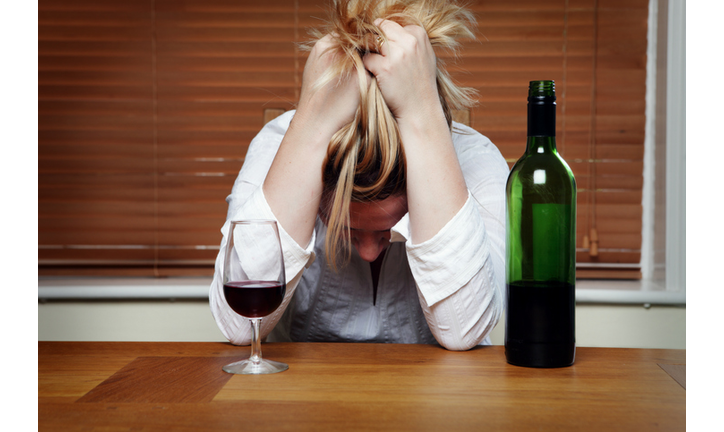 Depressed Woman with Red Wine