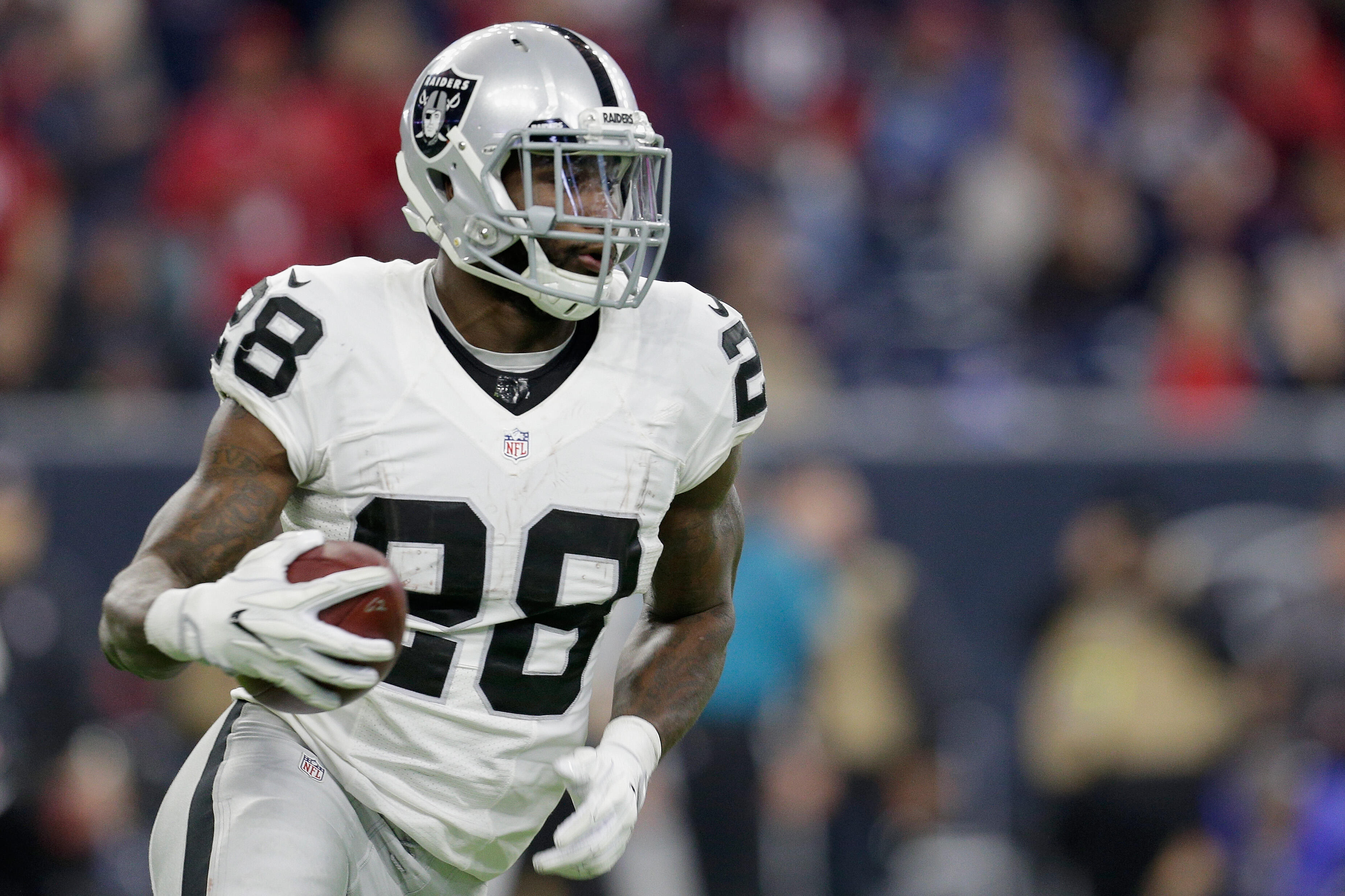 HOUSTON, TX - JANUARY 07: Latavius Murray #28 of the Oakland Raiders carries the ball against the Houston Texans in the AFC Wild Card game at NRG Stadium on January 7, 2017 in Houston, Texas.  (Photo by Thomas B. Shea/Getty Images)