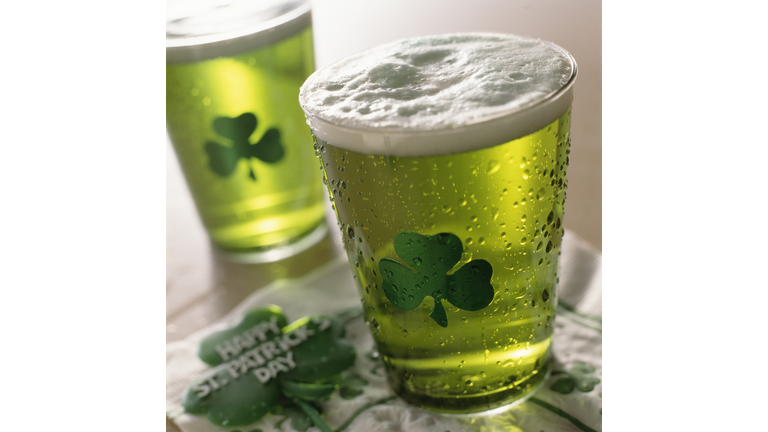 Close up of beverages with shamrocks on glass