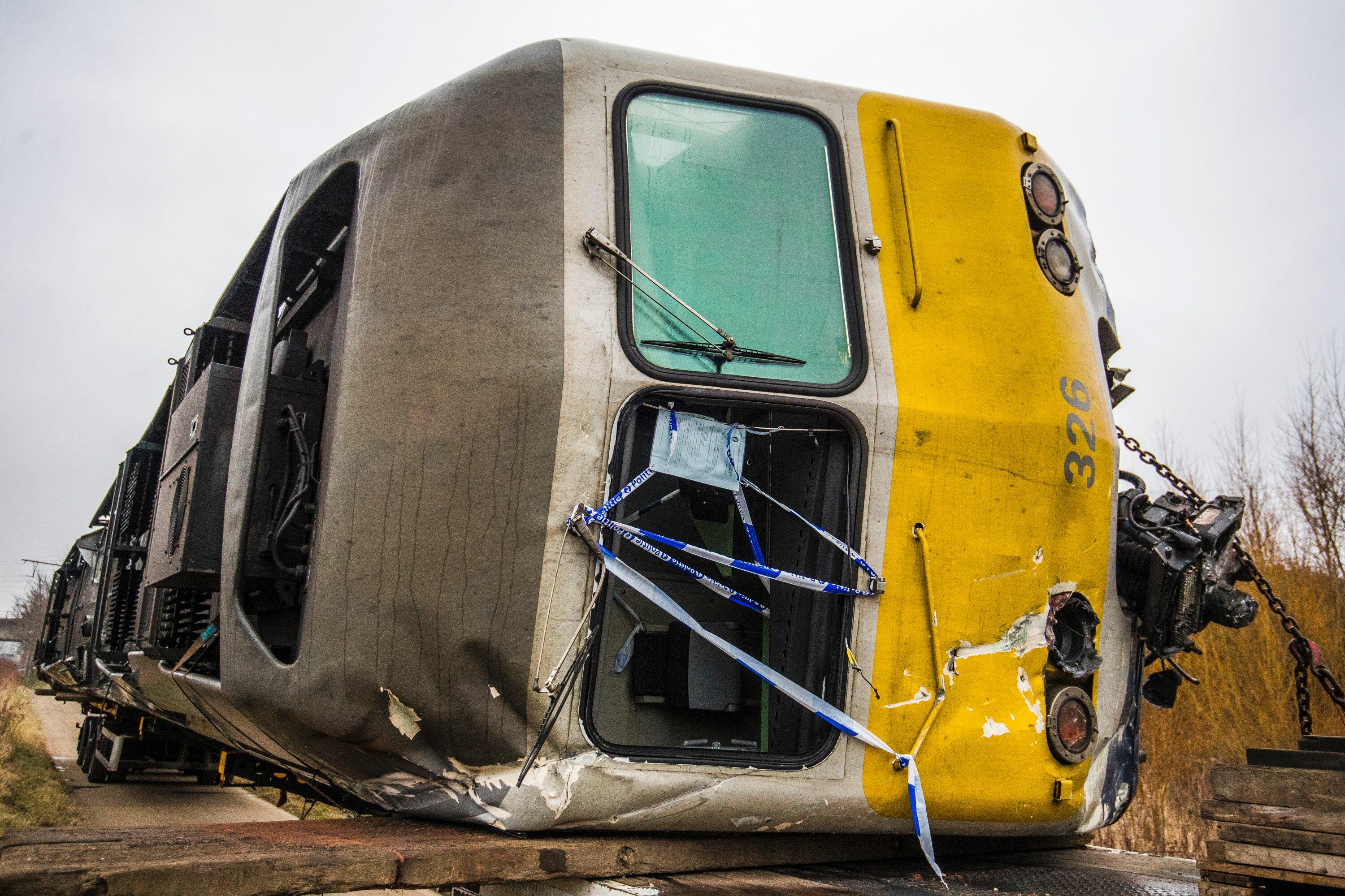 A train that derailed on February 18 is pictured before being towed from the railroad track at the site of the accident in Keseel-Lo, Leuven (Louvain) on February 20, 2017.  One person died and 27 others were injured when a train derailed on February 18 s