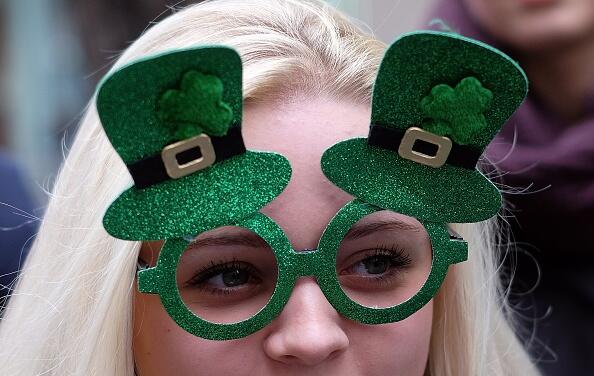 A girl watches marchers during the St Patrick's Day parade in New York on March 17, 2015. AFP PHOTO/JEWEL SAMAD        (Photo credit should read JEWEL SAMAD/AFP/Getty Images)