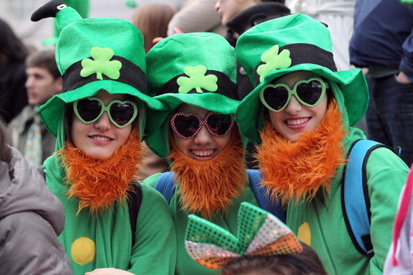 Spectators dressed as leprechauns attend St Patrick's Day parade in Dublin on March 17, 2014. More than 100 parades are being held across Ireland to mark St Patrick's Day, the feast day of the patron saint of Ireland, with up to 650,000 spectators expected to attend the parade in Dublin. AFP PHOTO/ PETER MUHLY        (Photo credit should read PETER MUHLY/AFP/Getty Images)