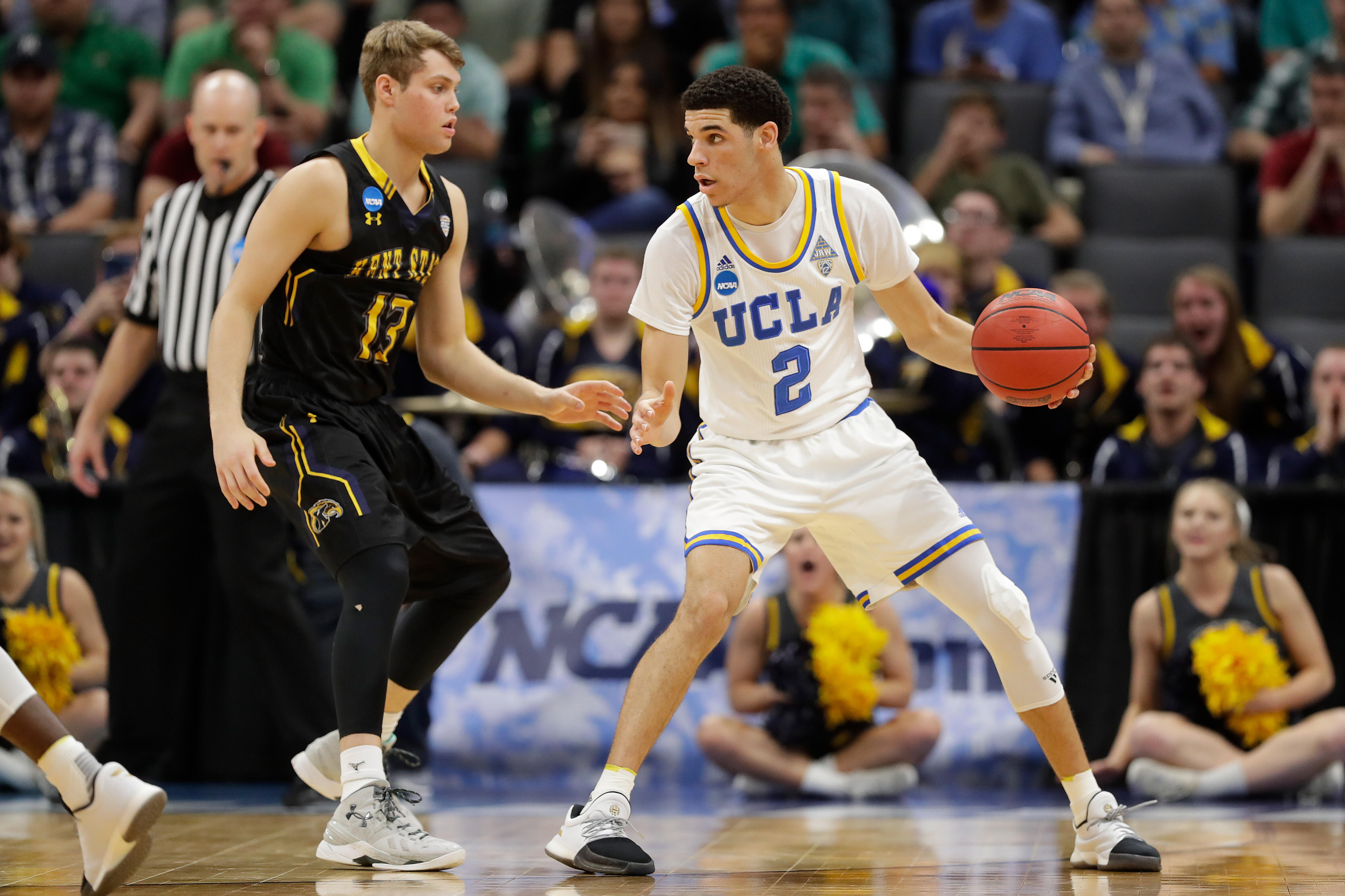 SACRAMENTO, CA - MARCH 17: Lonzo Ball #2 of the UCLA Bruins is defended by Mitch Peterson #13 of the Kent State Golden Flashes during the first round of the 2017 NCAA Men's Basketball Tournament at Golden 1 Center on March 17, 2017 in Sacramento, Californ