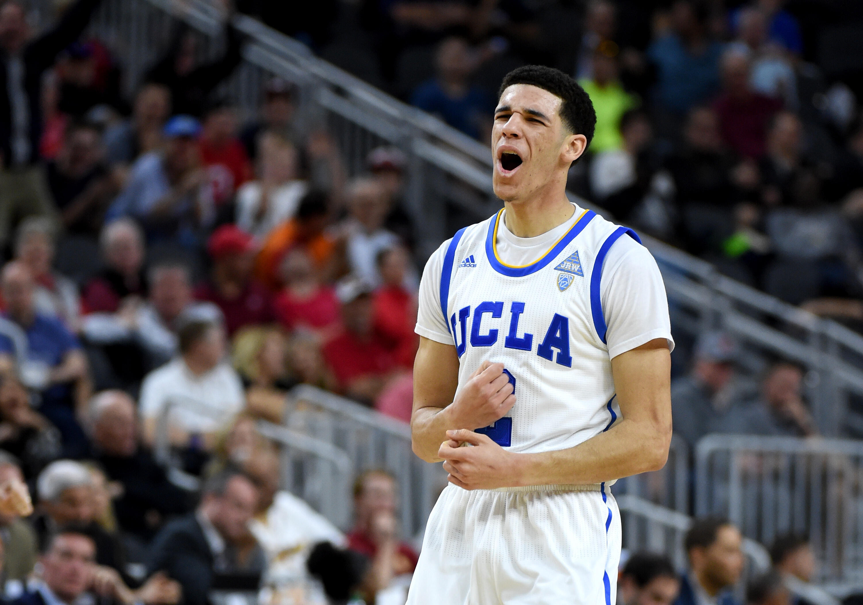 LAS VEGAS, NV - MARCH 09:  Lonzo Ball #2 of the UCLA Bruins celebrates after scoring against the USC Trojans during a quarterfinal game of the Pac-12 Basketball Tournament at T-Mobile Arena on March 9, 2017 in Las Vegas, Nevada. UCLA won 76-74.  (Photo by