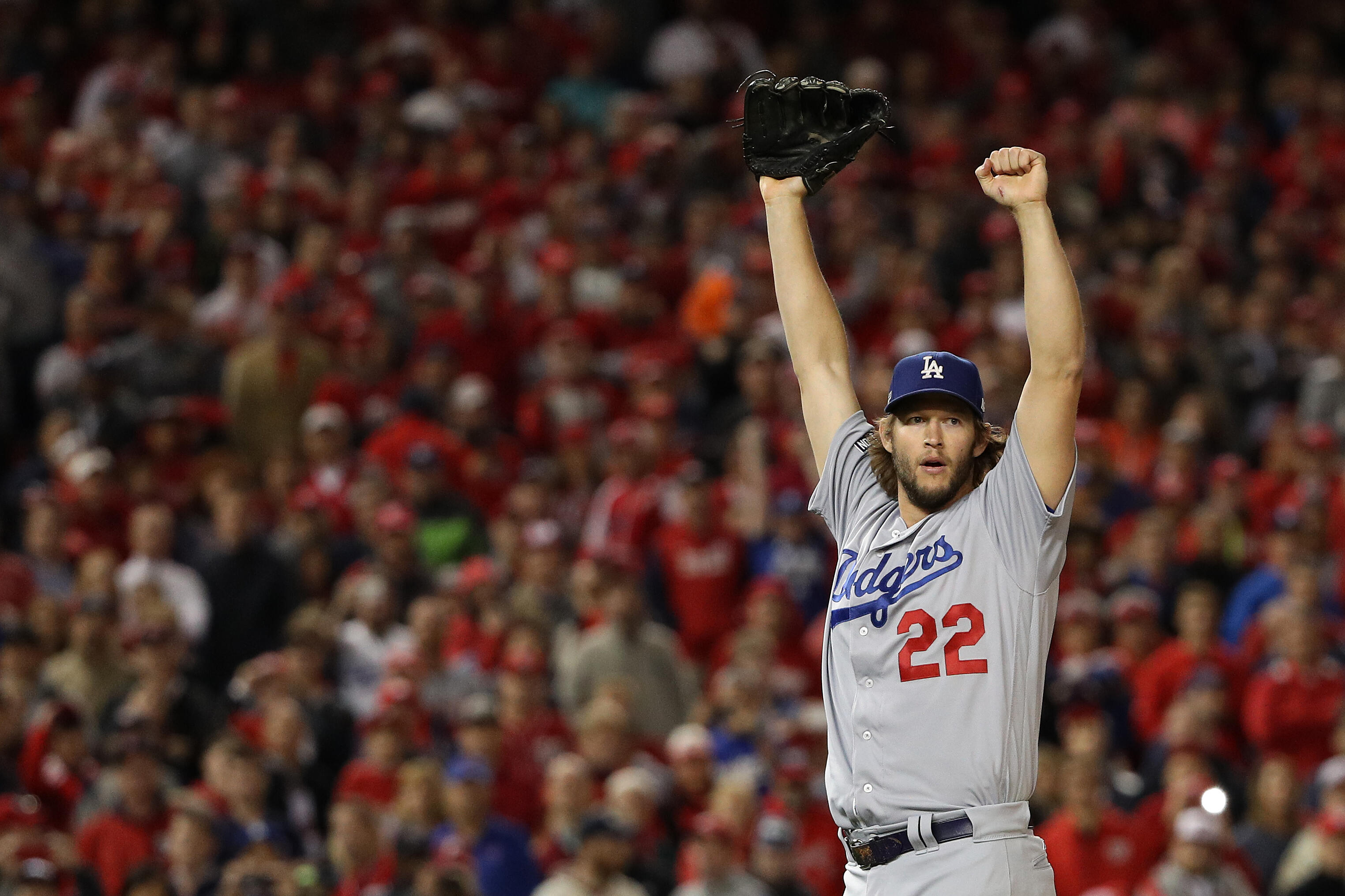 WASHINGTON, DC - OCTOBER 13: Clayton Kershaw #22 of the Los Angeles Dodgers celebrates after winning game five of the National League Division Series over the Washington Nationals 4-3 at Nationals Park on October 13, 2016 in Washington, DC. (Photo by Patr