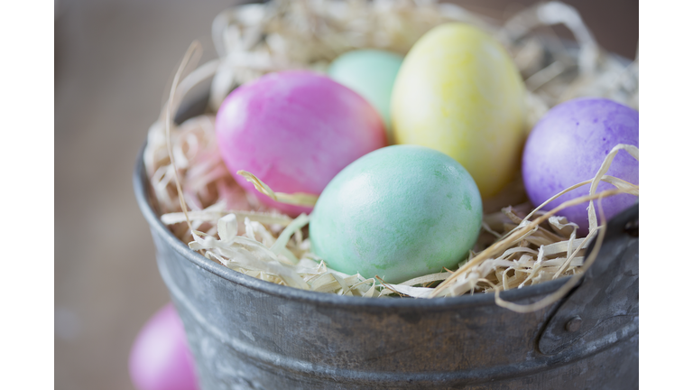 Close up of multicolor Easter eggs in bucket