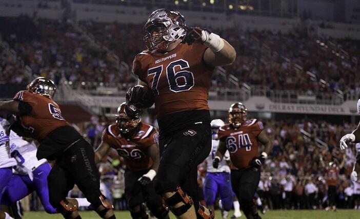 BOCA RATON, FL - DECEMBER 20: Forrest Lamp #76 of the Western Kentucky Hilltoppers scores a touchdown during the first half of the game against the Memphis Tigers at FAU Stadium on December 20, 2016 in Boca Raton, Florida. (Photo by Rob Foldy/Getty Images