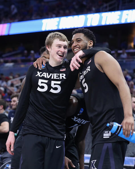 ORLANDO, FL - MARCH 18:  J.P. Macura #55 and Trevon Bluiett #5 of the Xavier Musketeers celebrate in the second half against the the Florida State Seminoles during the second round of the 2017 NCAA Men's Basketball Tournament at the Amway Center on March 18, 2017 in Orlando, Florida.  Xavier Musketeers won 99-61.  (Photo by Rob Carr/Getty Images)