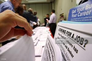 PASADENA, CA - MAY 14:  Job seekers look over job opening fliers at the WorkSource exhibit, a collaborative effort by governmental agencies to offer jobs and job training resources at the Greater Los Angeles Career Expo at the Pasadena Convention Center on May 14, 2009 in Pasadena, California. Nineteen exhibitors offer job and educational opportunities as well as advice from the Board of Equalization at the event that is open to the general public.  (Photo by David McNew/Getty Images)