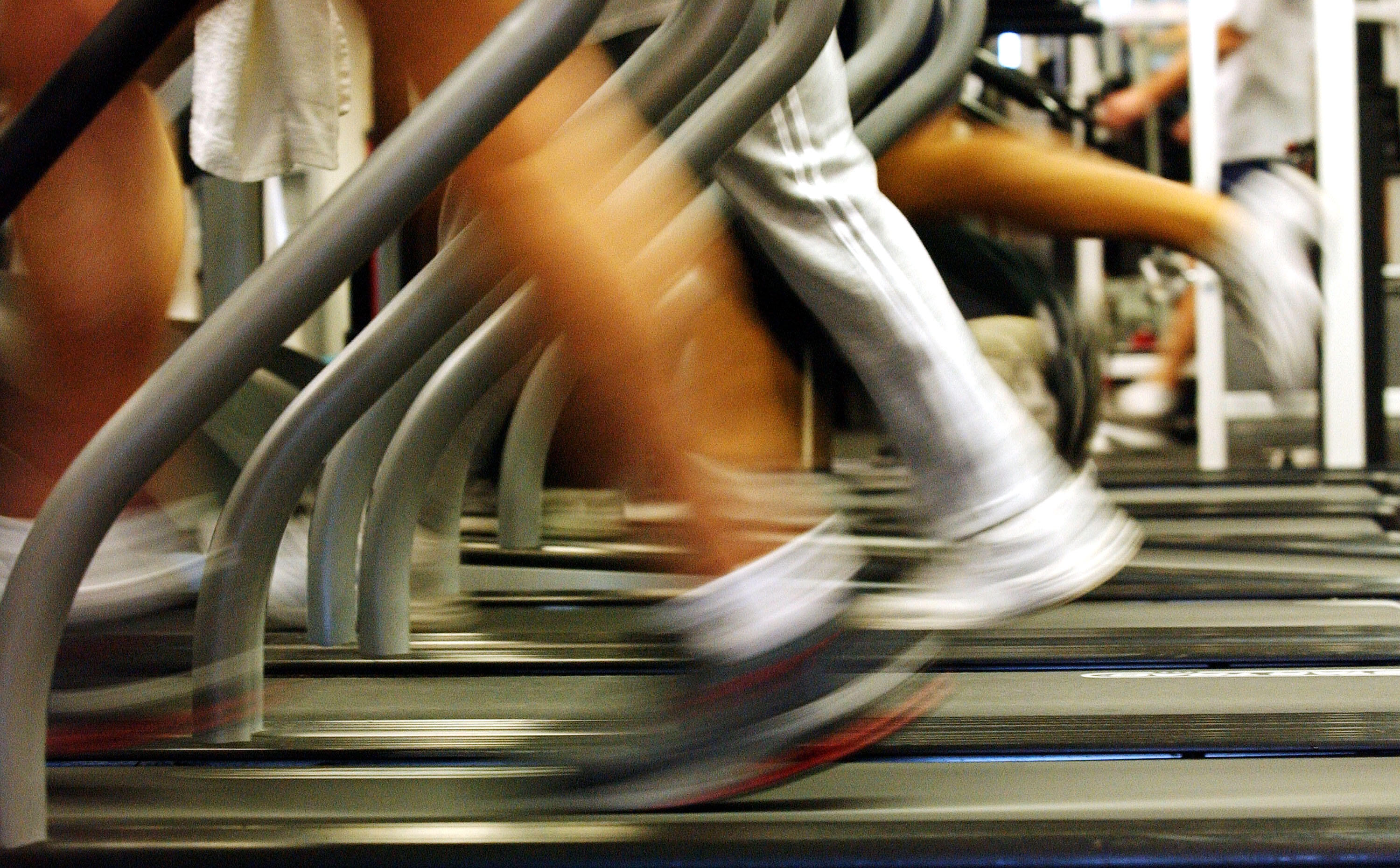 BROOKLYN, NEW YORK - JANUARY 2:  People run on treadmills at a New York Sports Club January 2, 2003 in Brooklyn, New York. Thousands of people around the country join health clubs in the first week of the new year as part of their New Year's resolution. M