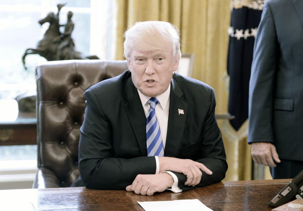 WASHINGTON, DC - MARCH 24: U.S. President Donald Trump reacts after Republicans abruptly pulled their health care bill from the House floor, in the Oval Office of  the White House on March 24, 2017 in Washington, DC. In a big setback to the agenda of President Donald Trump and the Speaker, Ryan cancelled a vote for the American Health Care Act, the GOP plan to repeal and replace the Affordable Care Act, also called 'Obamacare.' (Photo by Olivier Douliery-Pool/Getty Images)