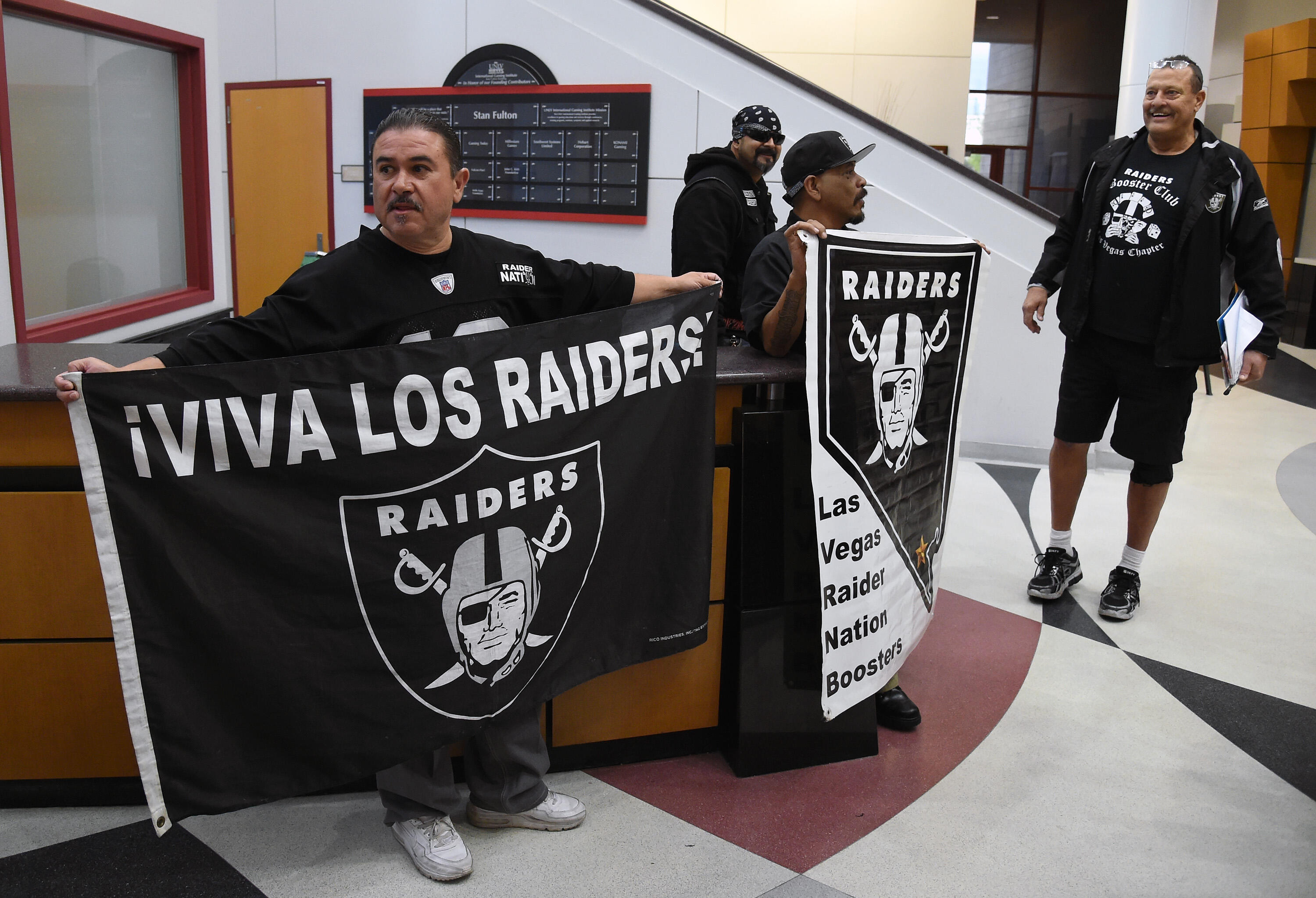 LAS VEGAS, NV - APRIL 28:  (L-R) Oakland Raiders fans Tony Curiel, Eric Carrillo, Richard Cervera, and John Baietti, all of Nevada, wait for Raiders owner Mark Davis to arrive at a Southern Nevada Tourism Infrastructure Committee meeting at UNLV with Raid