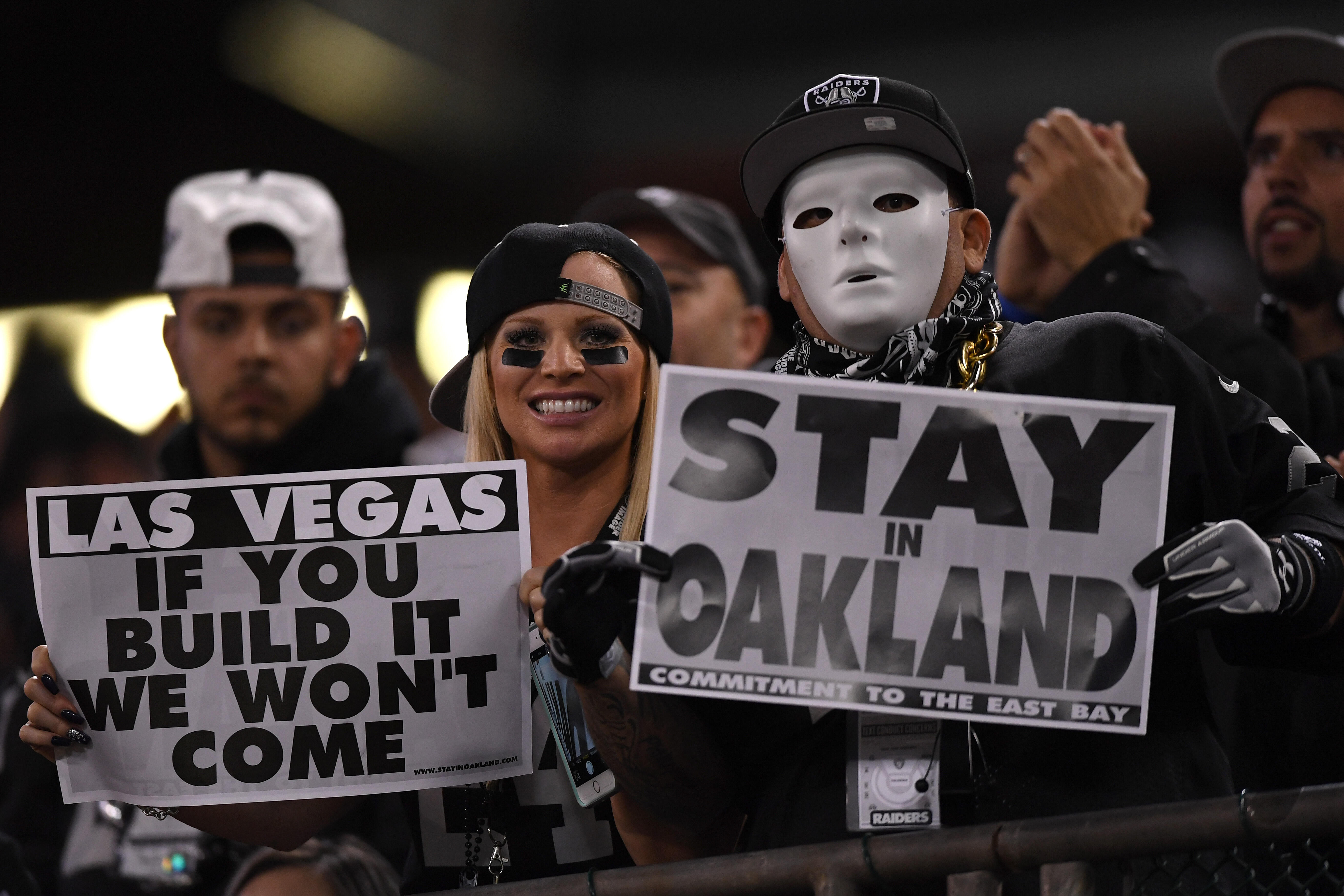 OAKLAND, CA - NOVEMBER 06:   Oakland Raiders fans display signs in support of the team staying in Oakland during their game against the Denver Broncos at Oakland-Alameda County Coliseum on November 6, 2016 in Oakland, California. (Photo by Thearon W. Hend