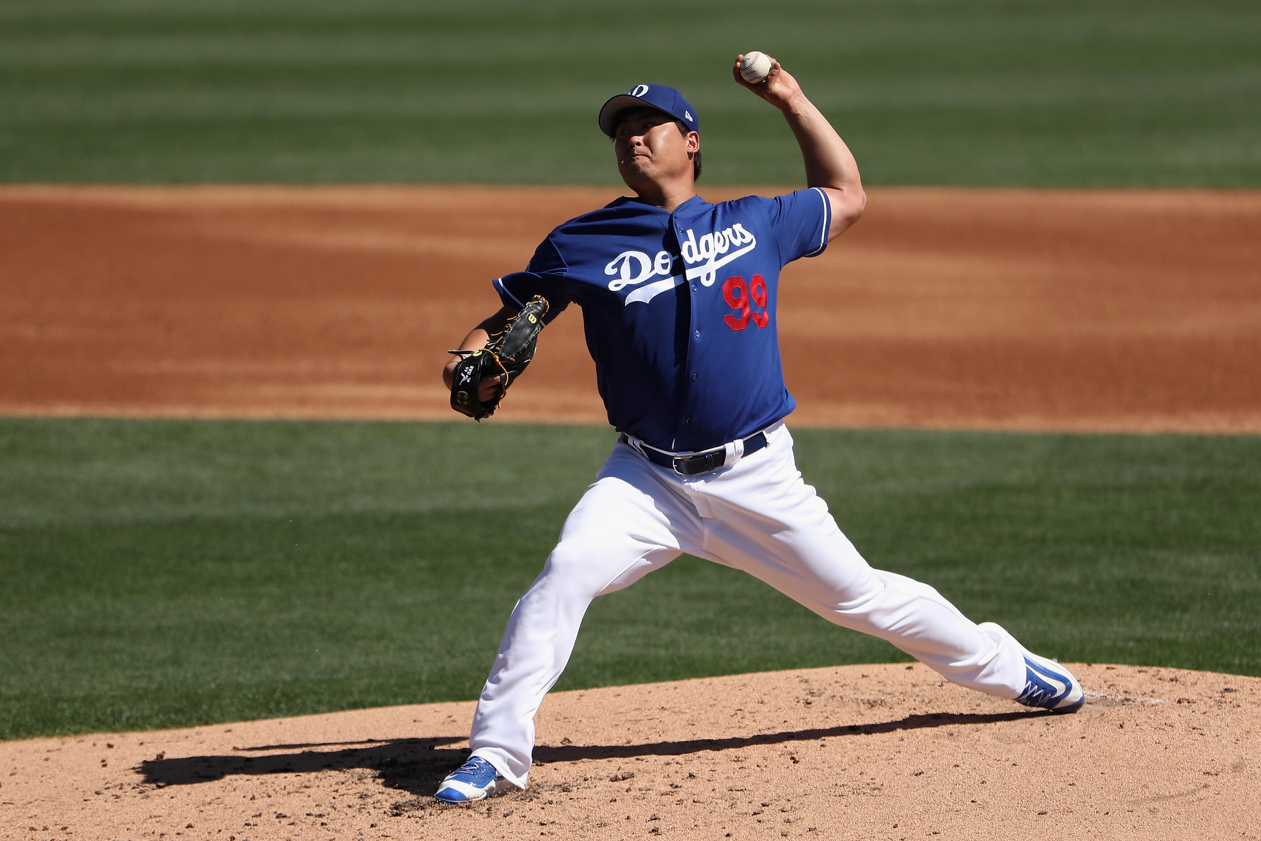 GLENDALE, AZ - MARCH 11:  Starting pitcher Hyun-Jin Ryu #99 of the Los Angeles Dodgers pitches against the Los Angeles Angels during the second inning of the MLB spring training game at Camelback Ranch on March 11, 2017 in Glendale, Arizona.  (Photo by Ch