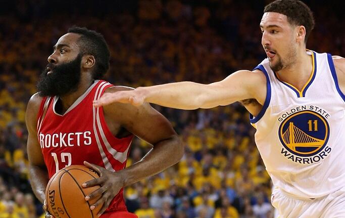 OAKLAND, CA - APRIL 27:  James Harden #13 of the Houston Rockets drives on Klay Thompson #11 of the Golden State Warriors in Game Five of the Western Conference Quarterfinals during the 2016 NBA Playoffs at ORACLE Arena on April 27, 2016 in Oakland, Calif
