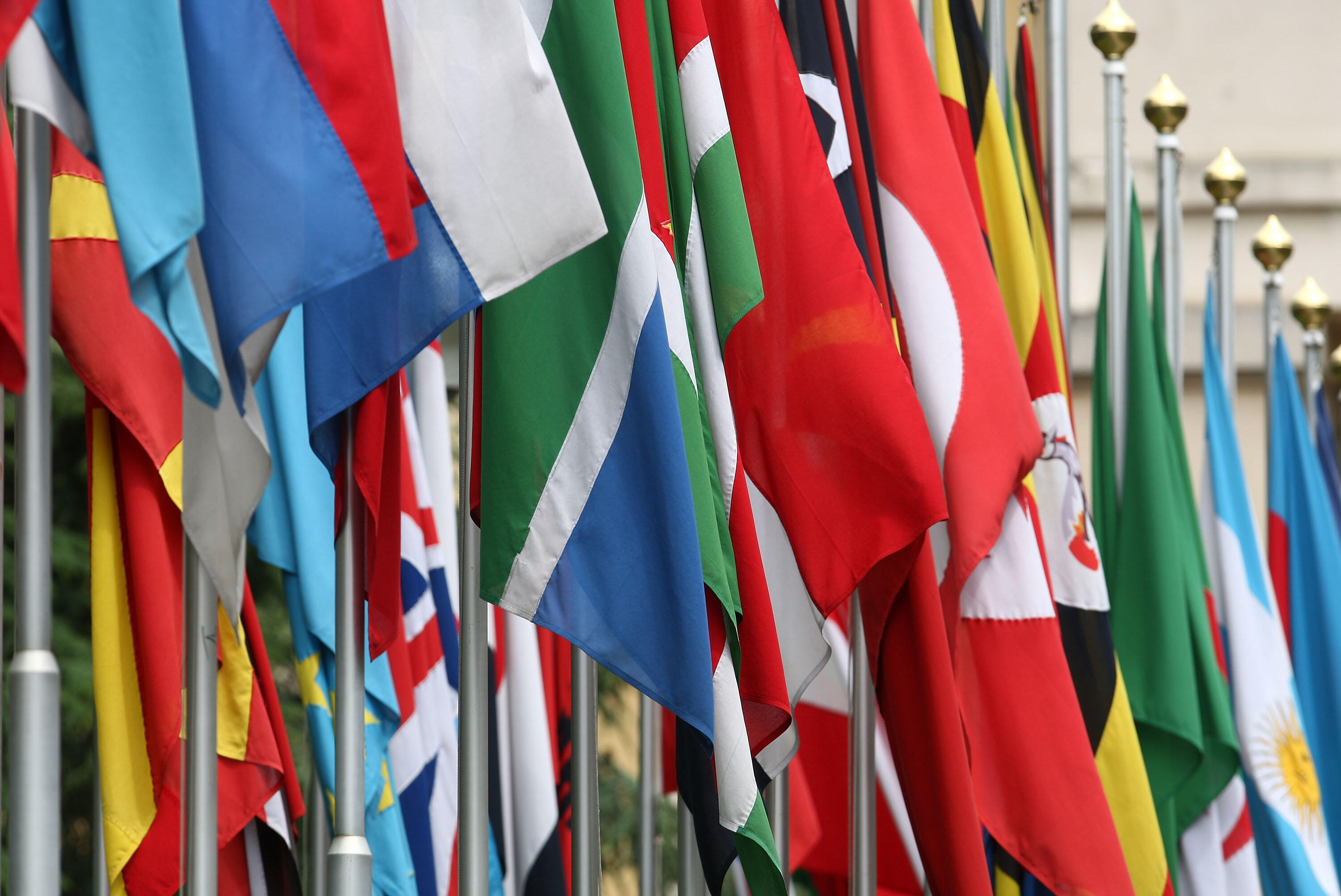 GENEVA - JUNE 08:  Numerous national flags are seen in front of the United Nations Office (UNOG) on June 8, 2008 in Geneva, Switzerland. Housed at the Palais des Nations, the United Nations Office at Geneva serves as the representative office of the Secre